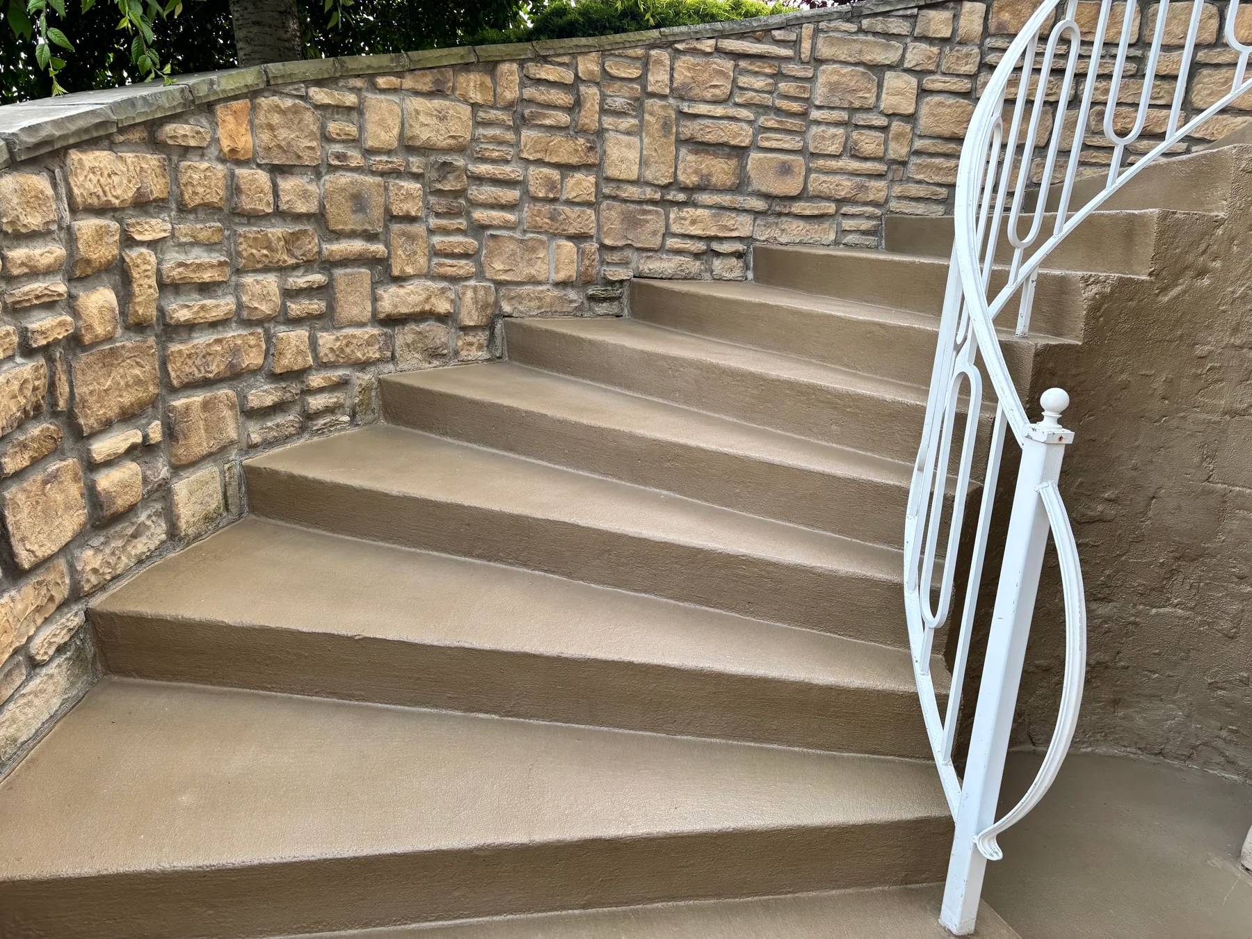 Wide view of concrete stair overlay and front entry resurfacing in Western New York