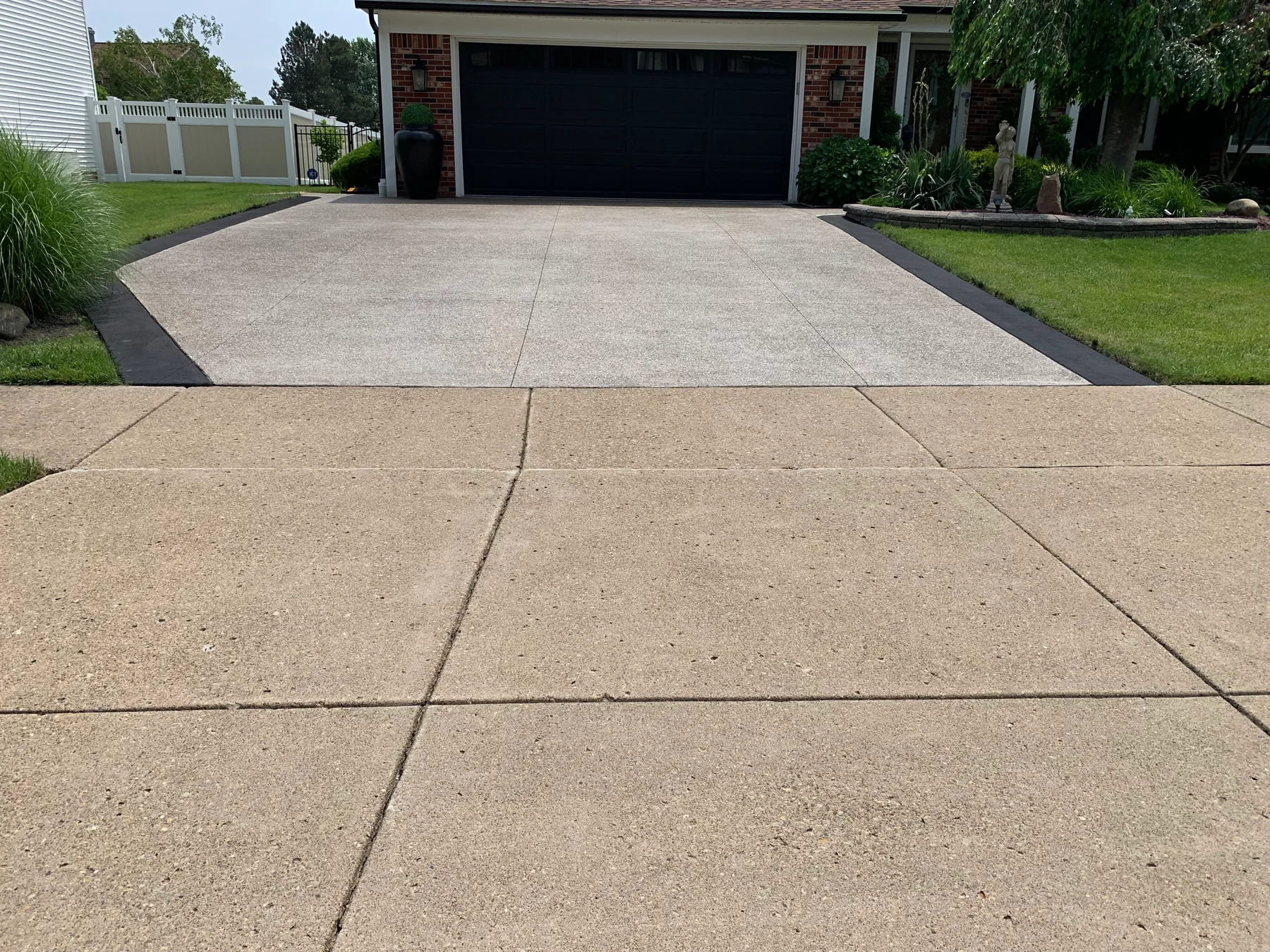 Close view of repaired and resurfaced residential concrete driveway near Buffalo NY